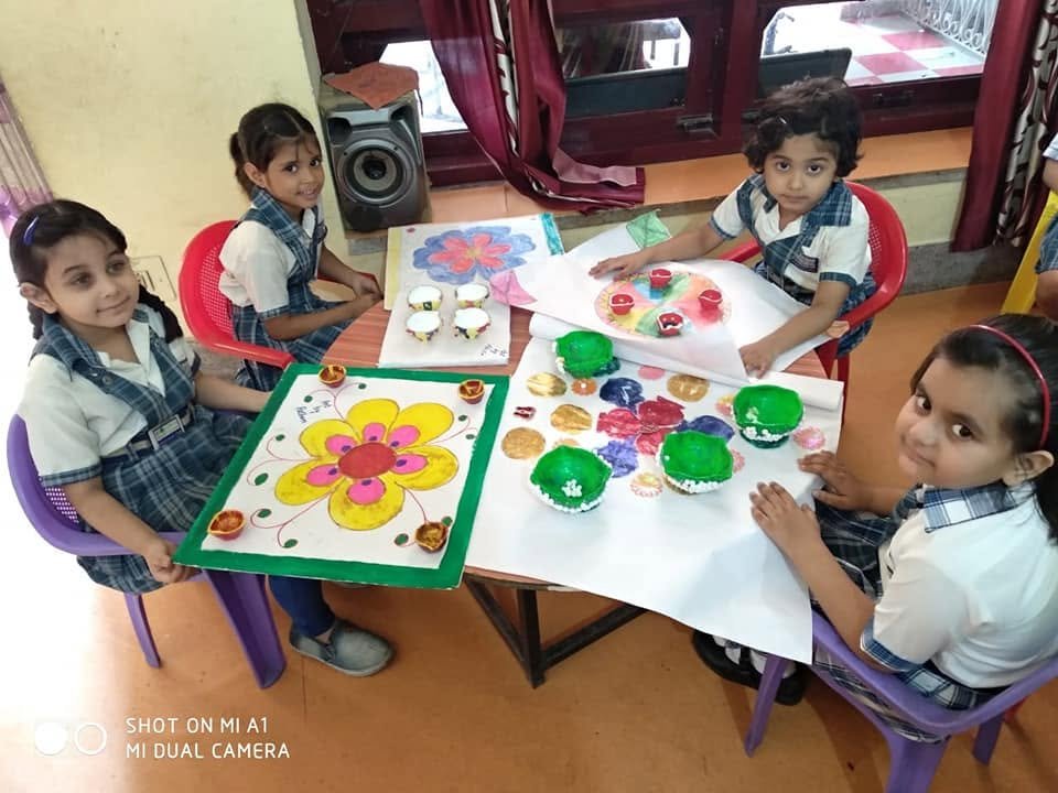 Children learning and participating in activities at Elina Kinder Garten